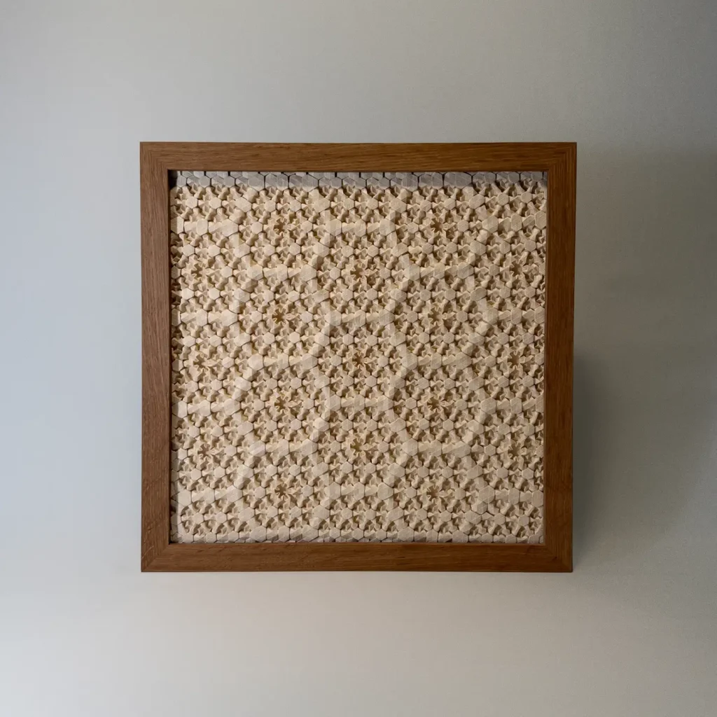 Intricate origami tessellation framed artwork by Charlie Weitzenberg