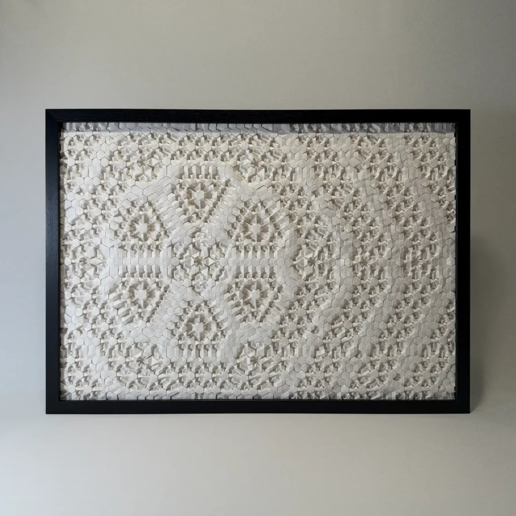 Intricate origami tessellation framed artwork by Charlie Weitzenberg