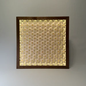intricate origami tessellation art in a custom lightbox frame