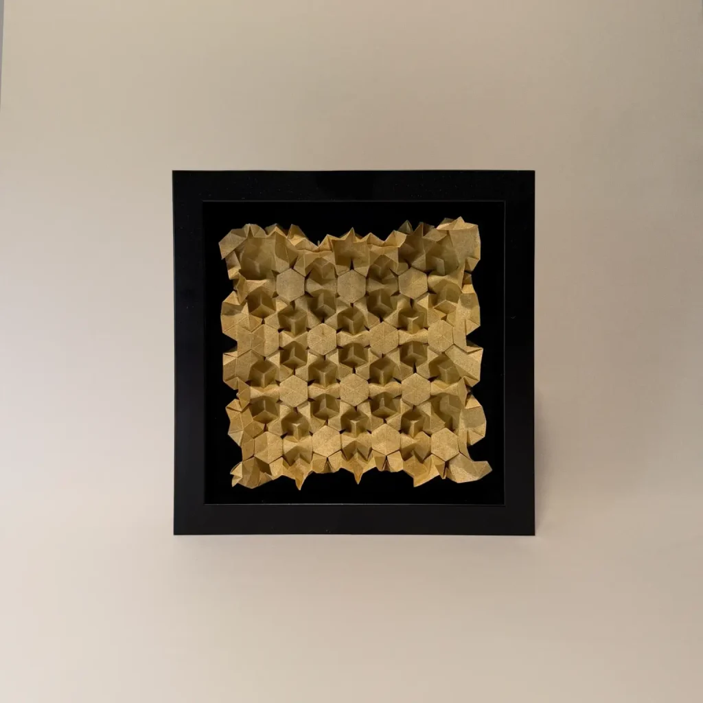 origami tessellation art in a black frame by charlie weitzenberg